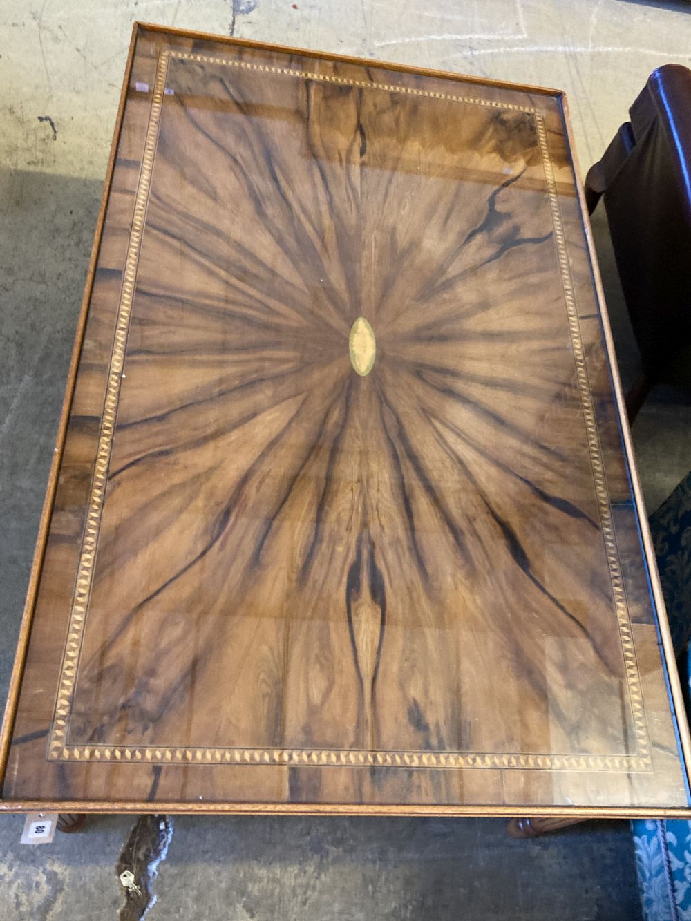 A reproduction rectangular inlaid yew coffee table, width 123cm, depth 78cm, height 52cm
